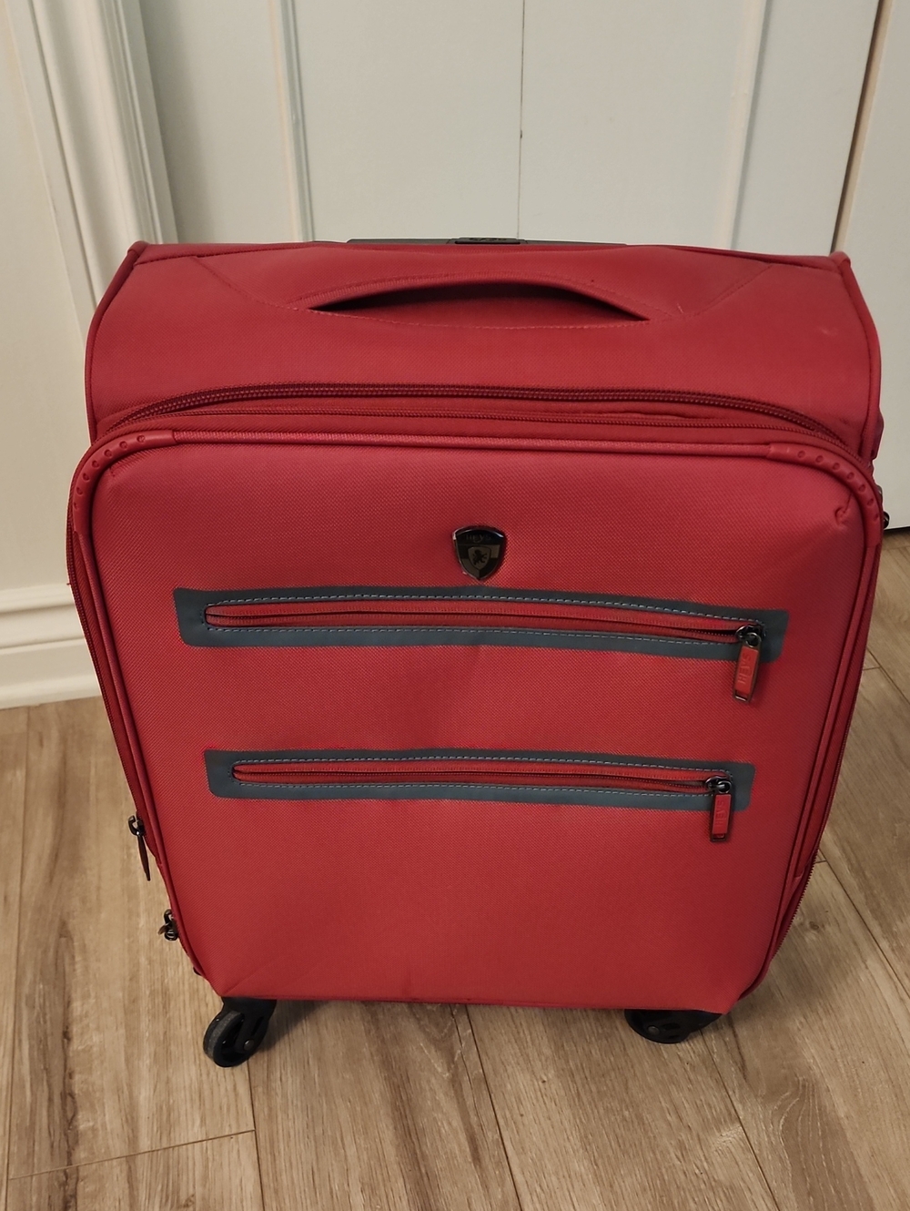 Stylish Red Carry-On Travel Bag with Front Zip Pockets